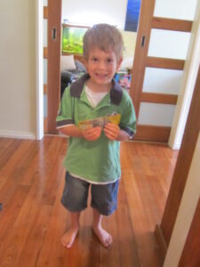 Ways to earn money for students shown through Chayse preparing lolly bags after planning his Candy Man business