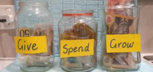 Money lessons for kids using give spend and grow jars