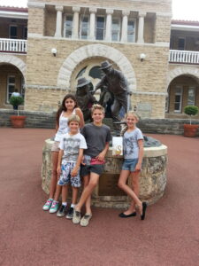 Kids outside the Perth Mint learning how to buy Perth Mint coins and understand assets