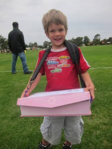 Business ideas for students shown through Chayse selling lolly bags at the soccer grounds