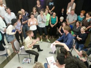 Teen participating in a workshop activity to raise entrepreneurial kids through learning by doing and stepping outside their comfort zone