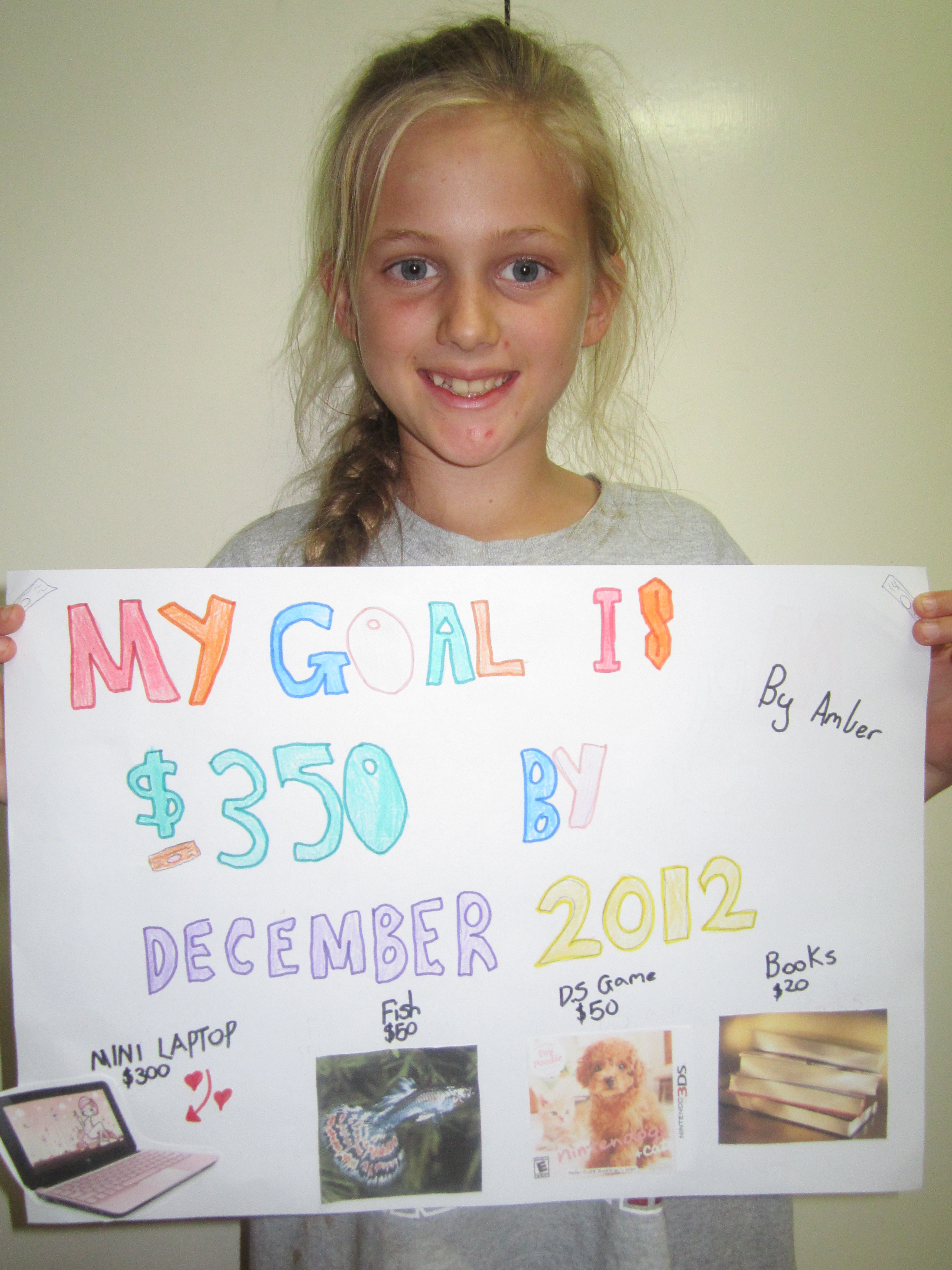 Amber's vision board showing goal setting and enterprise goals for kids