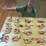 Ways to earn money for students shown through Chayse preparing lolly bags for his Candy Man business