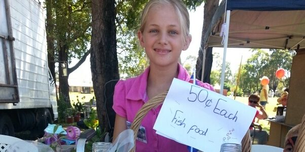 what can i sell to make money as a student Amber holding price sign