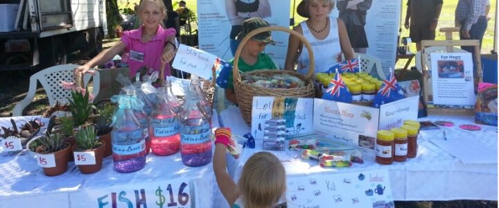 Amber Flynn and Kit running a stall at the Burekup Country Fair as a marketing lesson for kids