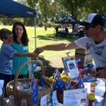 Chayse making a sale at the Burekup Fair as one of the business ideas for young entrepreneurs