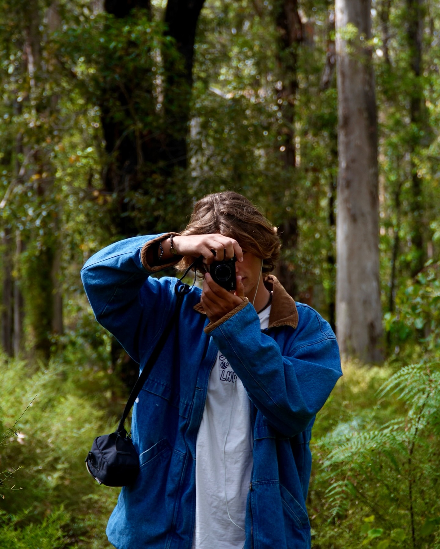 Kit Howitt with his camera as a young traveller, photographer and content creator