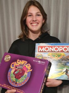 Akaisha holding Monopoly and Cashflow 101 as games about entrepreneurship