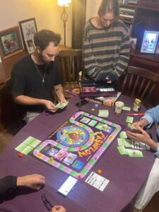 Amber and Blake making financial decisions while playing Cashflow 101