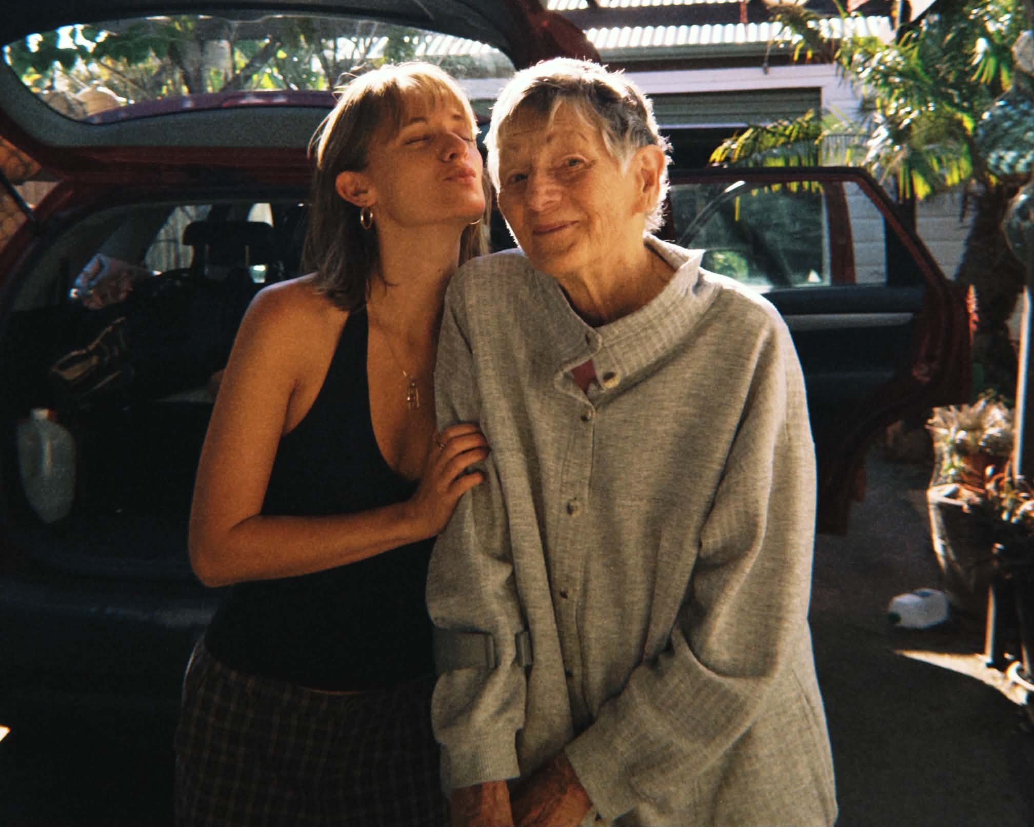 Amber showing affection to her grandmother during a family visit