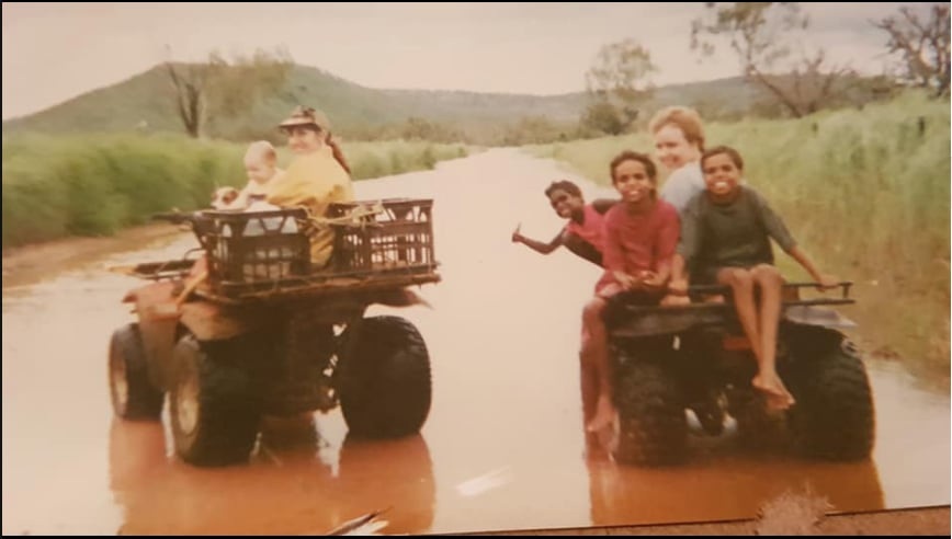 Cathy with baby Kaitlin on a quad bike with friends in Kalumburu, Western Australia