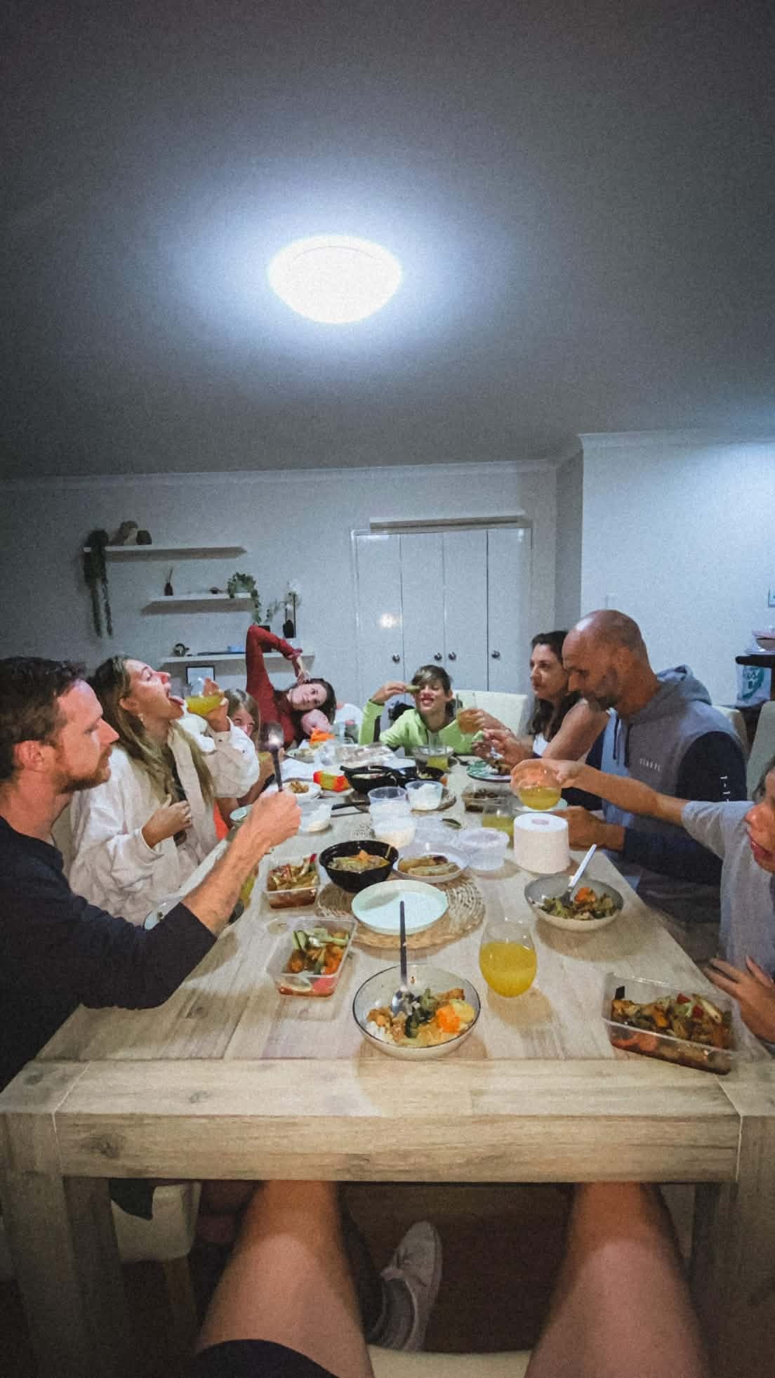 The Howitt family laughing and mucking around together during a lively family dinner